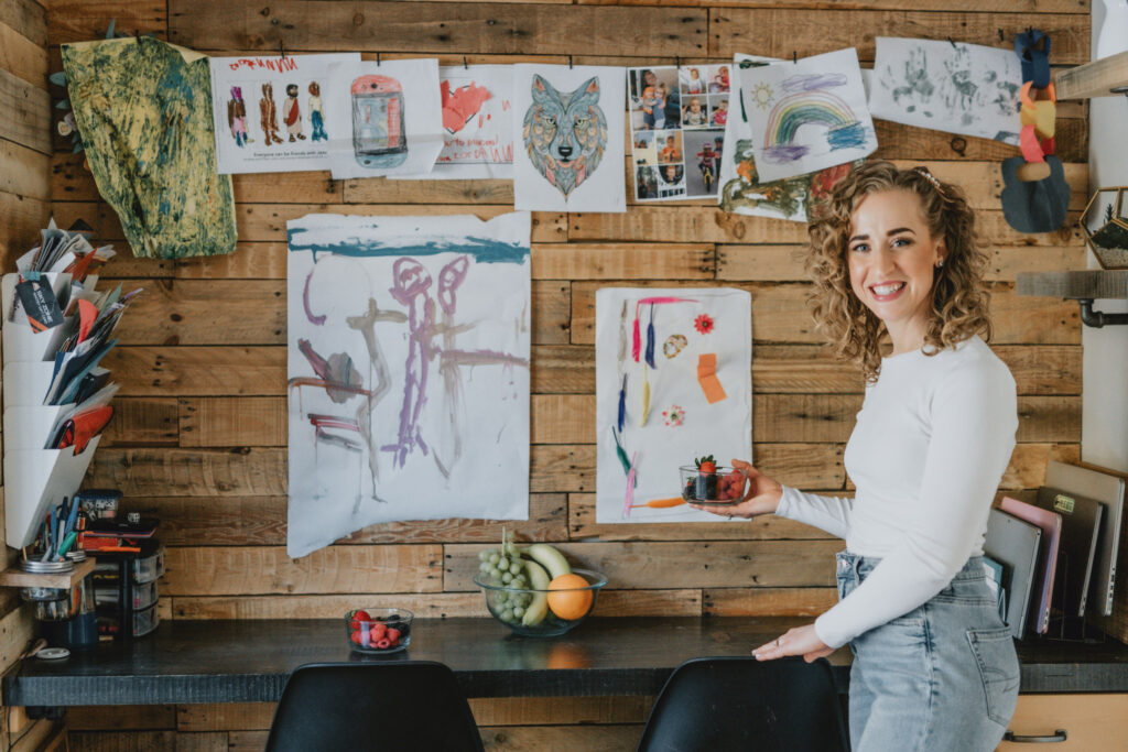 Wellness coach Danni Smith smiling in a cozy home office environment