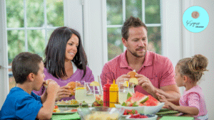 A family enjoying a balanced meal at home, supporting healthy habits guided by a Wellness Coach.