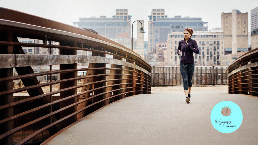 Woman jogging on a city bridge as part of a wellness coaching program with a Wellness Coach.